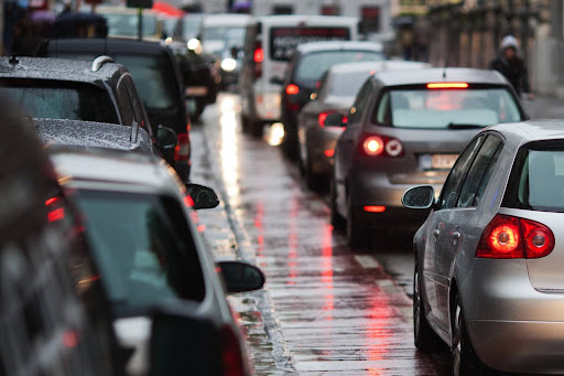 A line of vehicles stopped because of a vehicle accident which reached out to Uber’s insurance policy.