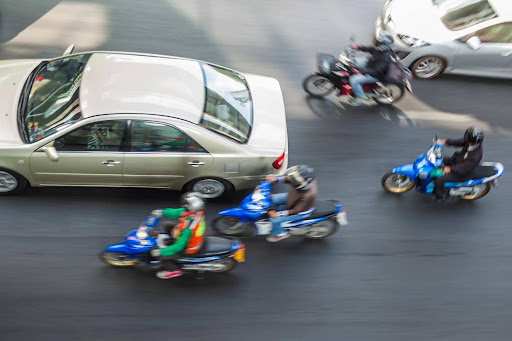 Motorcycle lane splitting is a practice that is often questioned for both safety and legality.