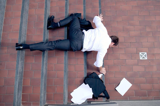 A man who has fallen down a flight of stairs; slip and fall cases can help injured victims recover damages.