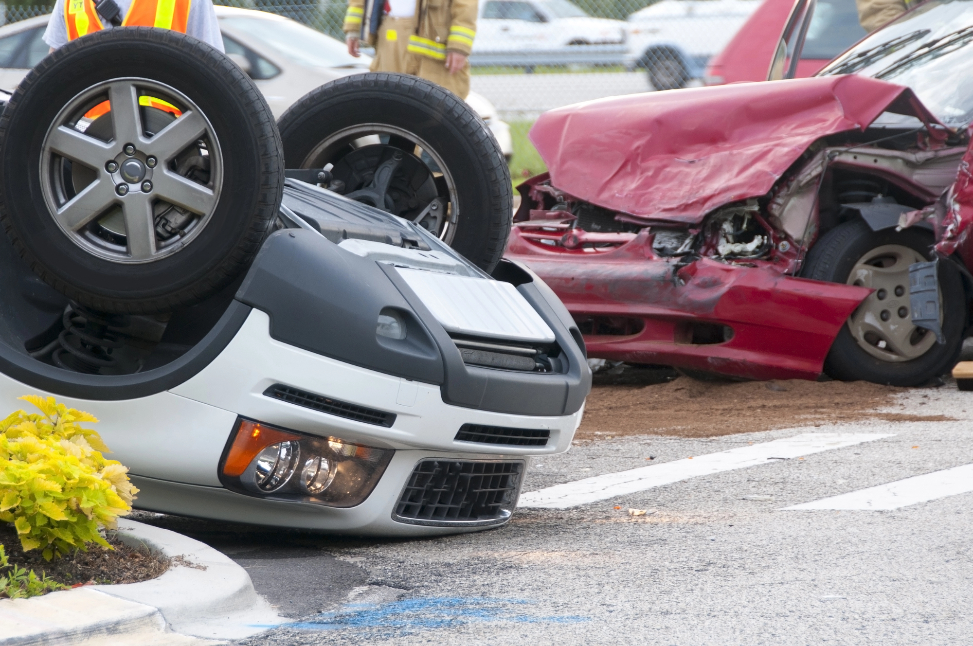 Overturned vehicle and damaged car after a serious collision, illustrating the potential dangers of parking lot accidents and the importance of understanding liability and safety risks.